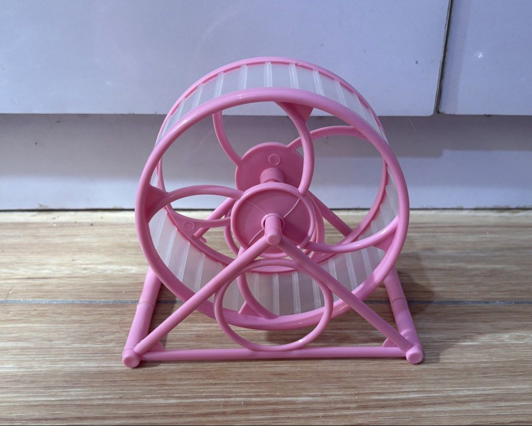 Hamster cage accessories bundle house wheel water bottle (Category: Homes & Other Pet Accessories) located in Quezon City. Submitted by kyjnll (Listing ID 1470987940, Image 3). Description: - Bundle of 4 essential hamster accessories - Blue & white wooden hideout house with climbing ramp - Pink silent running wheel for quiet nighttime exercise - Pink water bottle with integrated food dish base - Clear plastic cat-eared container for sand bath - C