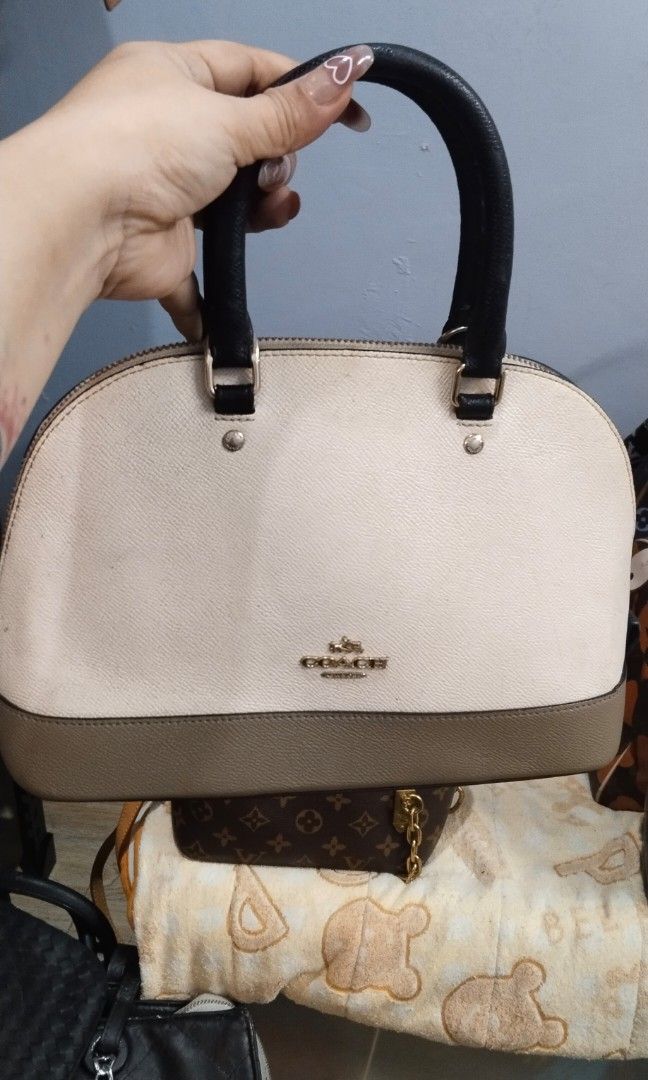Hand / sling bag (Category: Cross-body Bags) located in Trece Martires City. Submitted by vherma (Listing ID 1470964964, Image 3). Description: two-tone domed satchel bag from Coach, resembling the Coach Mini Sierra Satchel or Cora Dome Satchel in a cream/white and grey-brown colorblock design with black top handles. ykk zip.