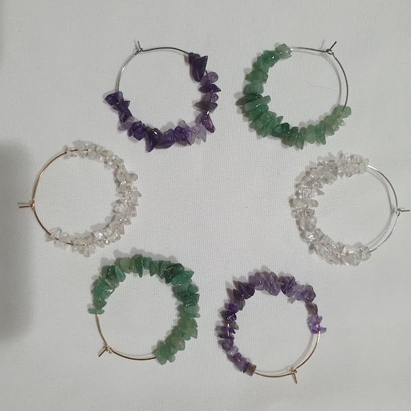 Handmade Crystal Chip Hoop Earrings (Category: Earrings) located in Caloocan City. Submitted by mma_222 (Listing ID 1471061596, Image 1). Description: - Handmade hoop earrings with natural crystal chips - Php 100 per pair - Available in 3 stones: Clear Quartz, Amethyst, Green Aventurine and black - Lightweight and comfortable for daily wear - Trendy boho-style jewelry.