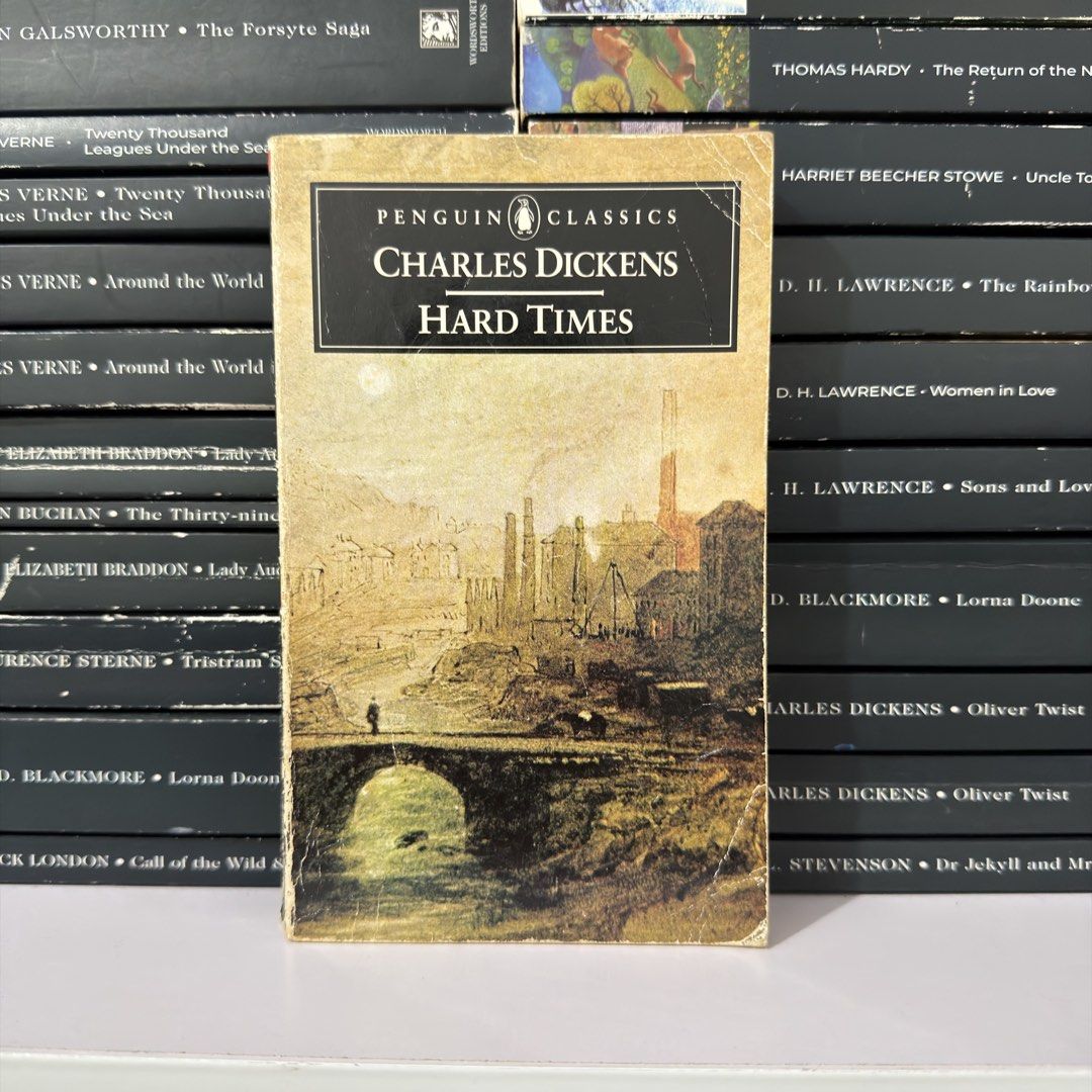 Hard Times by Charles Dickens Penguin Classics (Category: Storybooks) located in Lingayen. Submitted by readwjane (Listing ID 1471091532, Image 1). Description: - Title: Hard Times by Charles Dickens - Edition: Penguin Classics paperback - Cover: Vintage artwork featuring an industrial landscape and bridge - Condition: Pages intact and fully readable - Ideal for: English reading lists, literature students, and novel collectors.