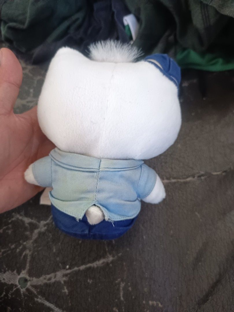 Hello Kitty McDonald's Daniel Uniform Plush Toy (Category: Plushies & Soft Toys) located in Caloocan City. Submitted by just_thrift_thing (Listing ID 1471018218, Image 2). Description: - Character: Kitty dressed in an exclusive McDonald's worker uniform - Outfit: Blue shirt, dark blue cap with McDonald's logo, patterned tie, and 'Daniel' name tag - Features: Classic white plush body, black whiskers, and iconic yellow nose - Condition: Good overal