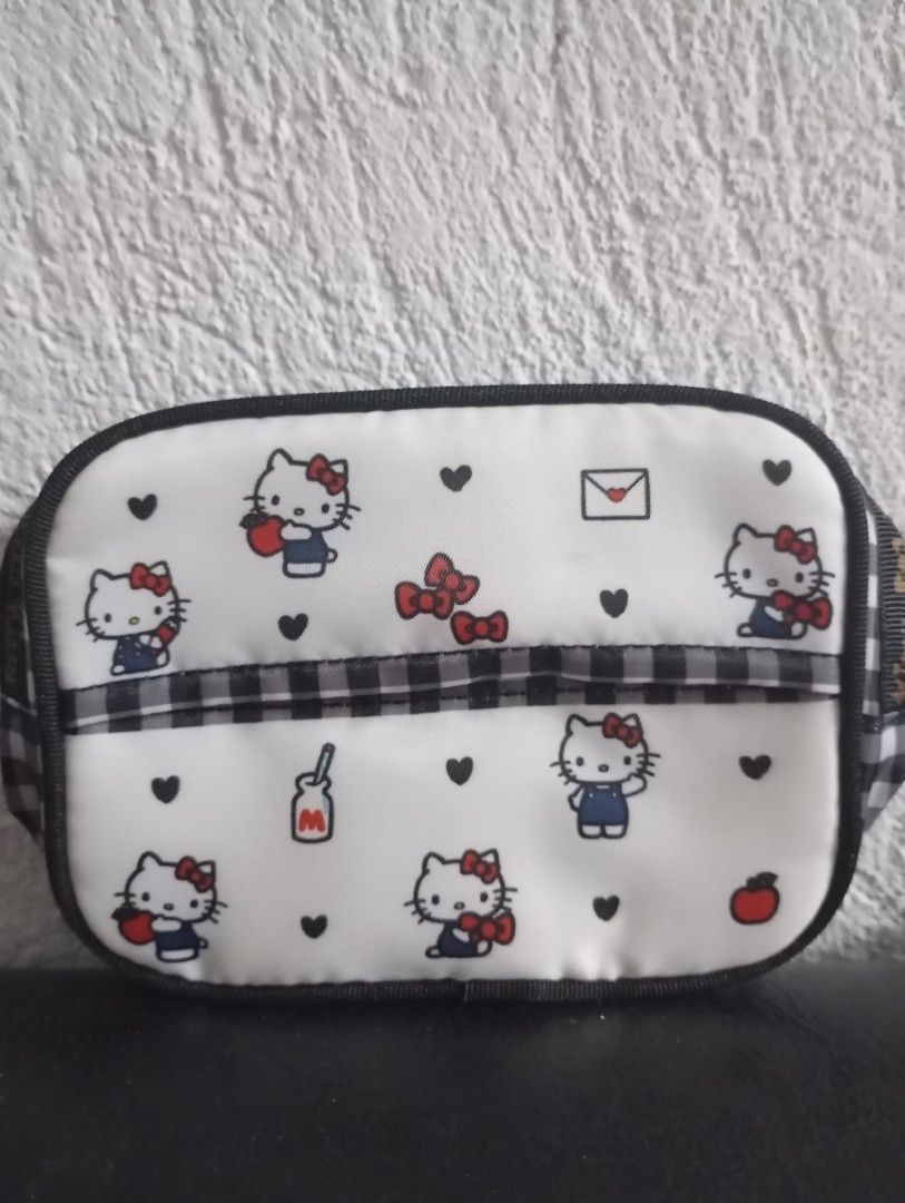 Hello kitty pouches and purse (Category: Purses & Pouches) located in Manila. Submitted by ysabel1102 (Listing ID 1471057983, Image 2). Description: all new and UN use all with paper tag 750 both but retail 380 big pouch retail 350 small pouch with pocket tissue holder.