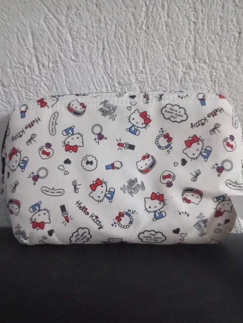Hello kitty pouches and purse (Category: Purses & Pouches) located in Manila. Submitted by ysabel1102 (Listing ID 1471057983, Image 3). Description: all new and UN use all with paper tag 750 both but retail 380 big pouch retail 350 small pouch with pocket tissue holder.