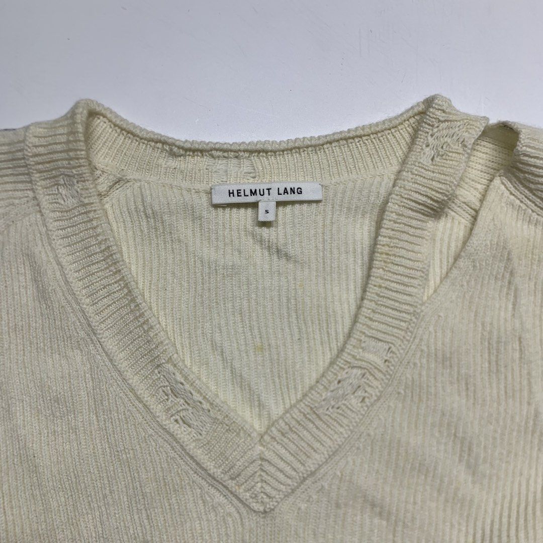 Helmut Lang - Ivory Distressed V-Neck Sweater (Category: Coats, Jackets and Outerwear) located in Manila. Submitted by shottas_21 (Listing ID 1471034159, Image 3). Description: Helmut Lang - Ivory Distressed V-Neck Sweater SIZE -Small CONDITION - 9/10 FLAW - Washable stain Long sleeve rib knit cotton wool and cashmere-blend sweater in ivory. Distressing throughout. Deconstructed V-neck collar. Extended thread detailing in black at sleeves. Tonal 