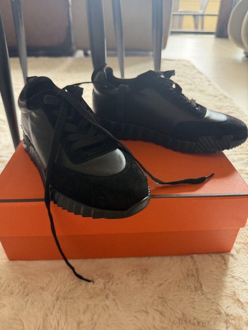 Hermes Black Noir Bouncing Sneakers with Box (Category: Sneakers & Footwear) located in Manila. Submitted by sanmer25 (Listing ID 1471024547, Image 3). Description: - Brand: Hermes - Color: all Black - Material: Combination of smooth leather (not sure if real leather) and soft suede (not sure if real suede leather) - Features: Chunky ridged rubber sole, lace-up front, heel pull tab - Condition: Clean overall, minimal wear on soles - Inclusions: o