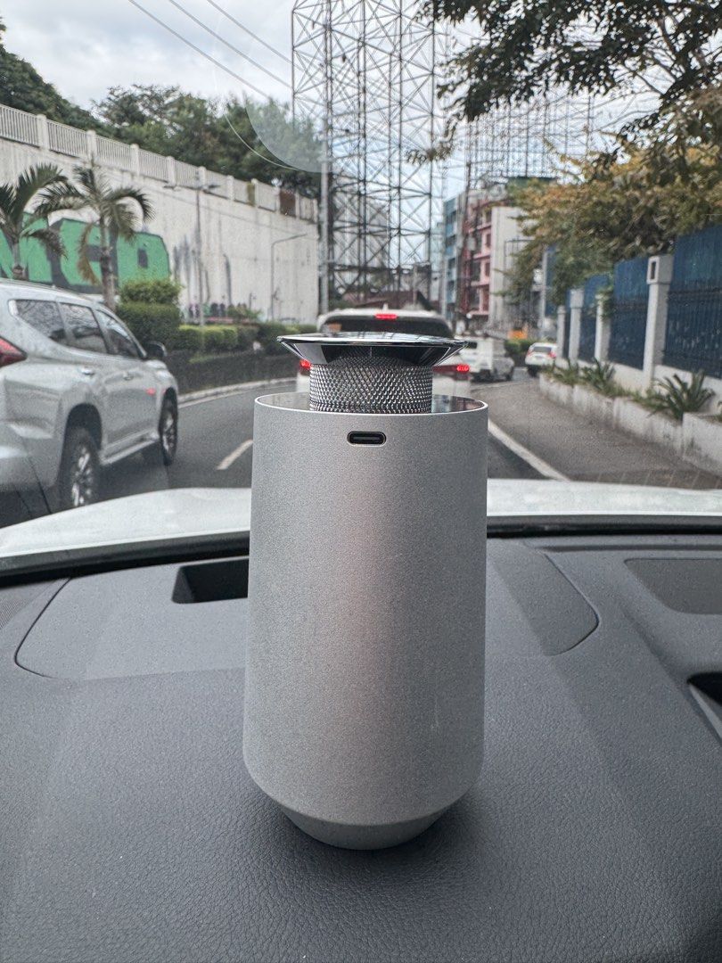 Hiessence HE40VW Aroma Diffuser (Category: Home Fragrance) located in San Juan City. Submitted by stefsclothes (Listing ID 1471023783, Image 2). Description: - Model: Hiessence HE40VW Aroma Diffuser - Finish: Modern silver with metallic grill top - Power: 3.5W with a reliable 2000mAh rechargeable battery - Port: Convenient Type-C charging port - Use: Compact and portable design, perfect for car or desk use.