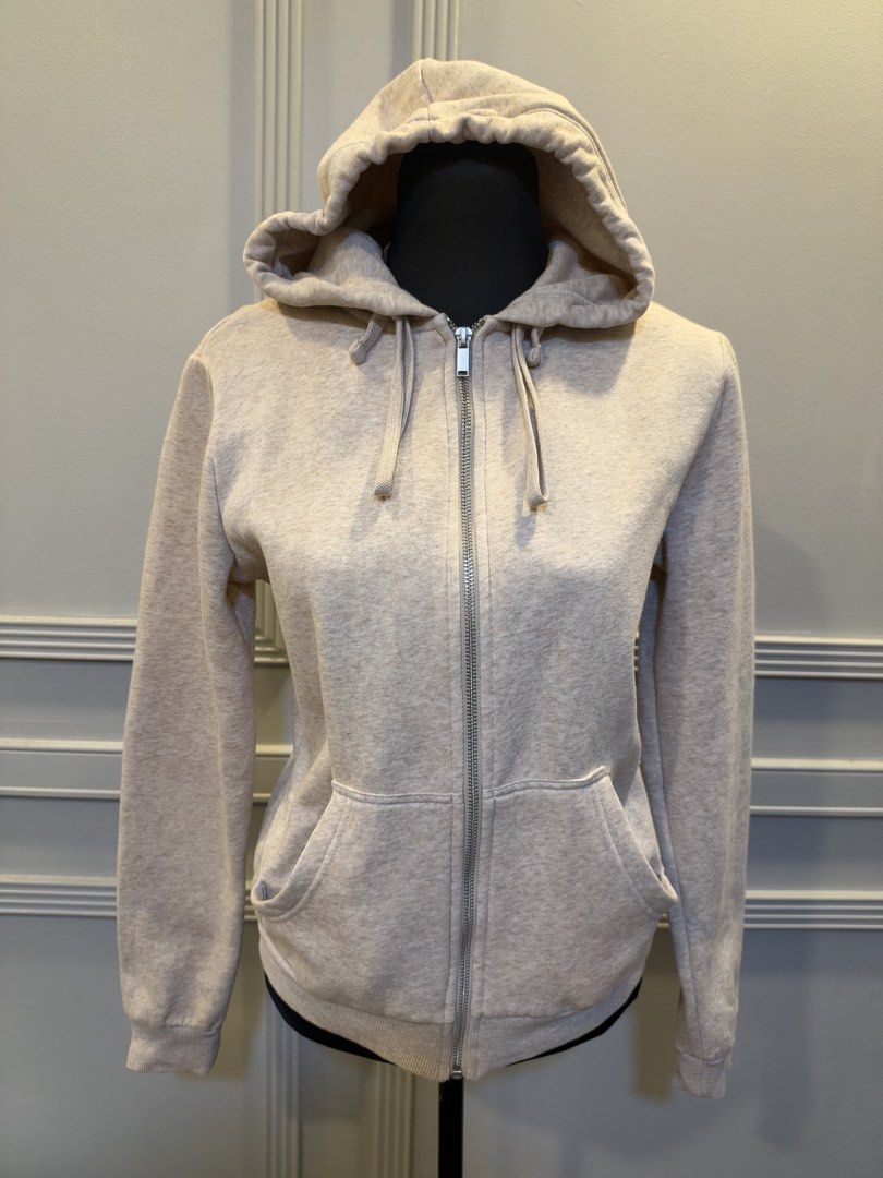 H&M Basics Beige Zip-up Hoodie Size S (Category: Coats, Jackets and Outerwear) located in Manila. Submitted by anjcuenca (Listing ID 1471097229, Image 3). Description: - Brand: H&M Basics - Style: Zip-up hoodie with full front zipper and adjustable drawstring hood - Color: Soft beige heather - Size: S (fits UK S) - Features: Two front pockets, cozy and soft fabric - Condition: Clean, excellent, and ready to wear.