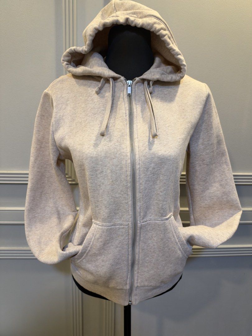 H&M Basics Beige Zip-up Hoodie Size S (Category: Coats, Jackets and Outerwear) located in Manila. Submitted by anjcuenca (Listing ID 1471097229, Image 1). Description: - Brand: H&M Basics - Style: Zip-up hoodie with full front zipper and adjustable drawstring hood - Color: Soft beige heather - Size: S (fits UK S) - Features: Two front pockets, cozy and soft fabric - Condition: Clean, excellent, and ready to wear.