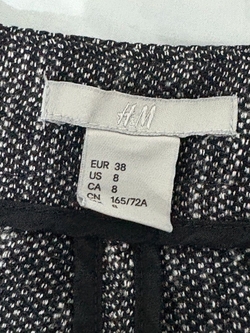 H&M Black White Tweed Pattern Trousers Size US 8 (Category: Jeans) located in Manila. Submitted by coolphoenix_f1e702 (Listing ID 1471015553, Image 3). Description: - Brand: H&M - Style: Black and white tweed patterned trousers - Size: US 8 / EUR 38 / CN 165/72A - Material: 73% polyester, 26% viscose, 1% elastane (Pocket lining: 80% polyester, 20% cotton) - Details: Solid structured waistband with stylish dark piping - Condition: Clean, excellent
