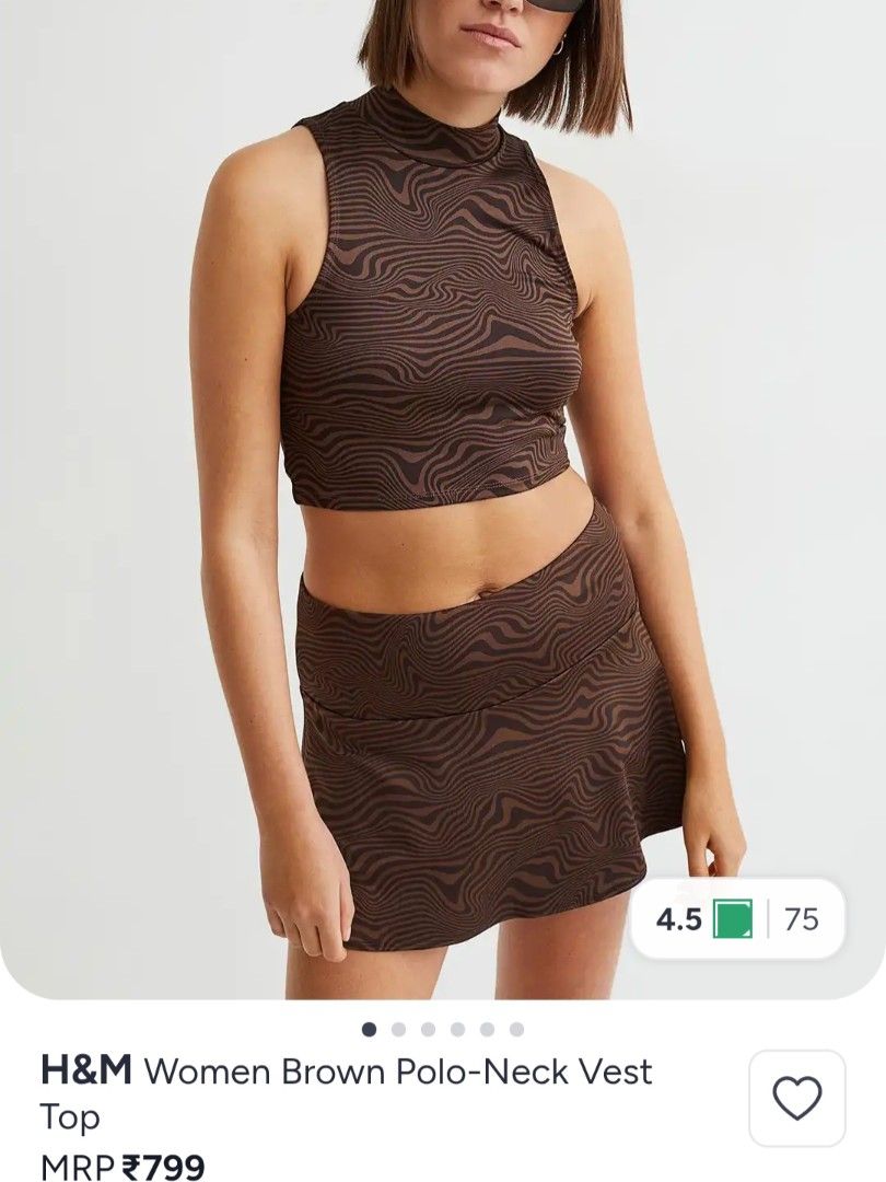 H&M Brown Zebra Print Mock Neck Crop Top (Category: Blouses) located in Bacoor. Submitted by Miss_Chuch0521 (Listing ID 1470963285, Image 2). Description: - Brand: H&M - Style: Sleeveless mock neck crop top - Pattern: Wavy brown zebra print (Y2K aesthetic) - Fit: Cropped length, sits at the waist - Material: Stretchy and super comfortable - Styling: Perfect to pair with skirts or high-waisted denim.