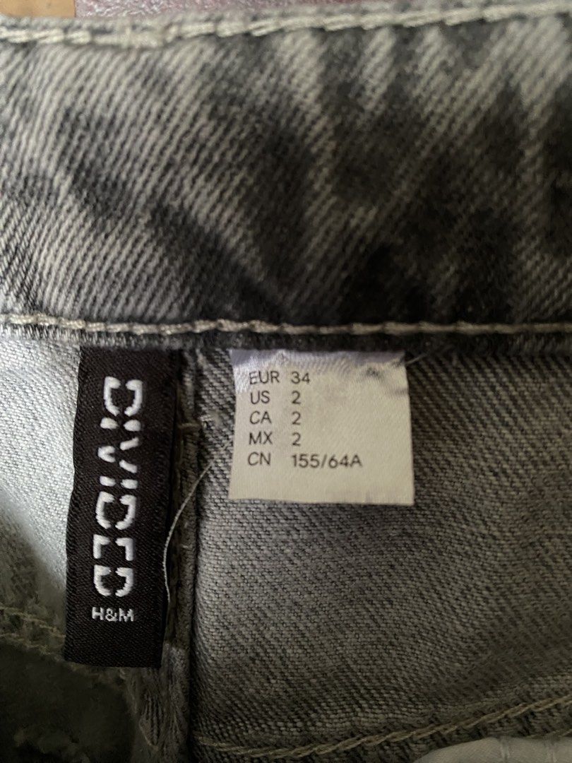 H&M Divided Grey Denim Jeans Size (Category: Jeans) located in Manila. Submitted by love_mami (Listing ID 1470992783, Image 2). Description: - Brand: H&M Divided - Size: EUR 34 / US 2 / 24-26 waist - Fit: High waist with wide legs and rolled cuffs - Color: Neutral washed grey - Condition: 10/10.