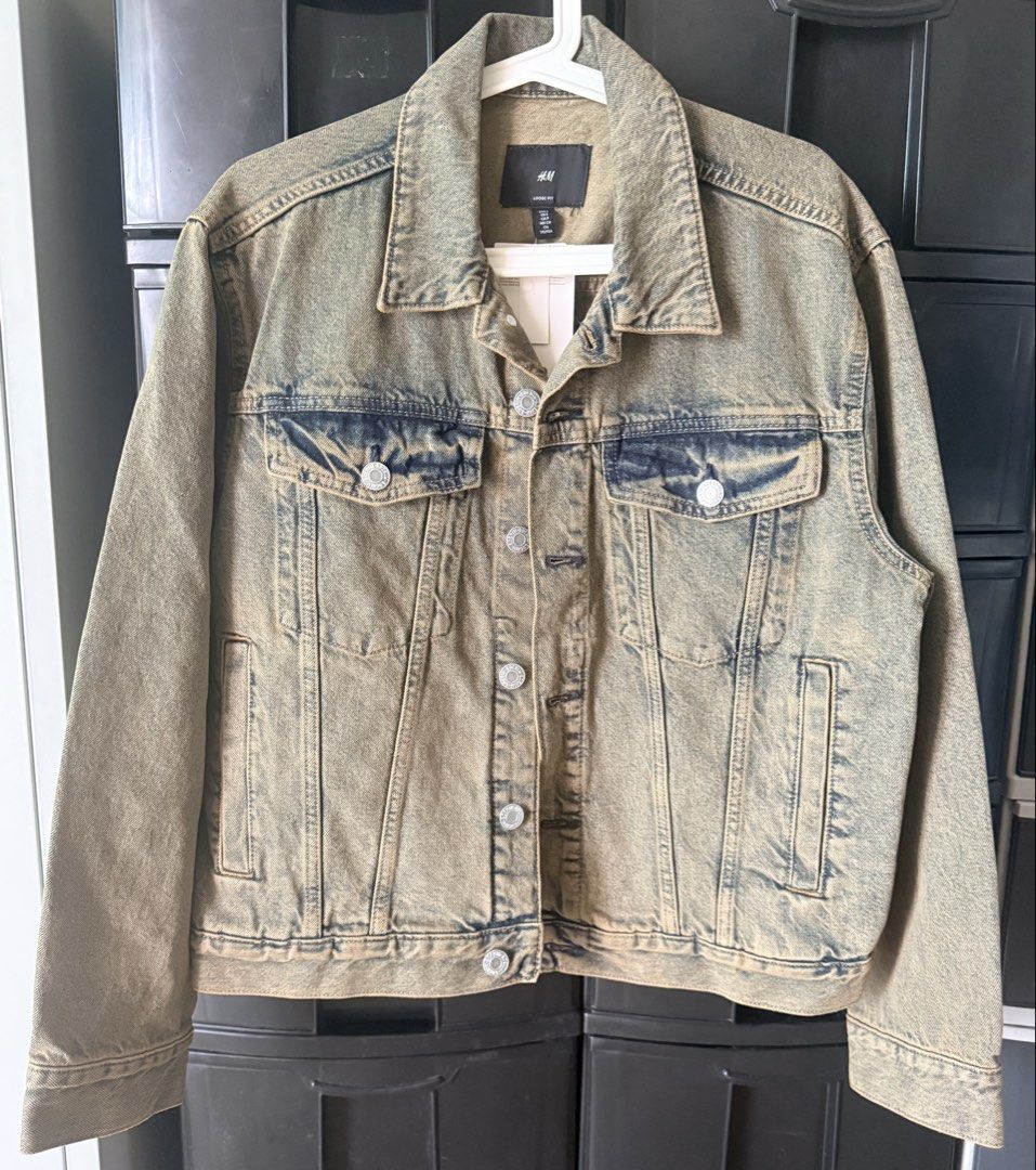 H&M Denim Jacket Brand New with Tag (Category: Coats, Jackets and Outerwear) located in Pasig City. Submitted by thetravellingguyinstyle (Listing ID 1470962175, Image 1). Description: - Brand: H&M - Item: Denim Jacket - Fit: Loose fit (great for layering) - Size: S - Condition: Brand new with tag attached - Features: Button-up front, chest pockets, and side pockets.