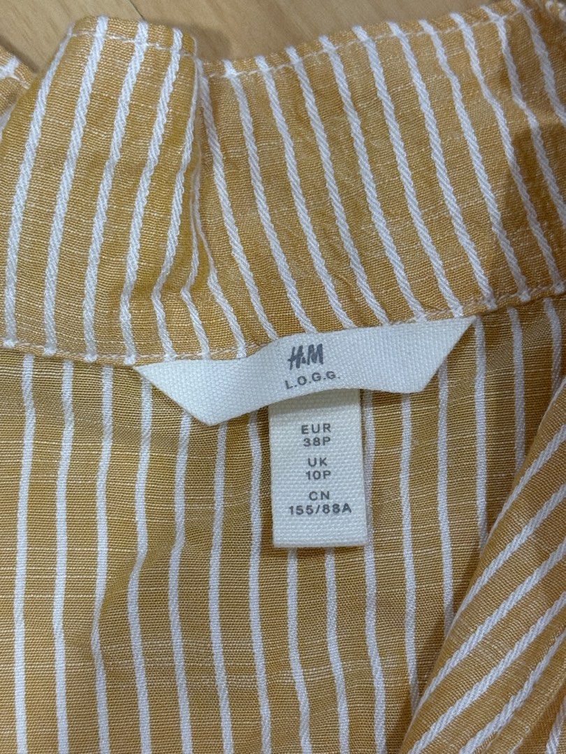 H&M Mustard Yellow & White Striped Tie-Front Blouse (Category: Blouses) located in Muntinlupa City. Submitted by alexisofia (Listing ID 1471086411, Image 3). Description: like new, worn a few times only / excellent condition Size: EUR 38 / UK 10 Brand: H&M L.O.G.G. Color: Mustard Yellow & White.