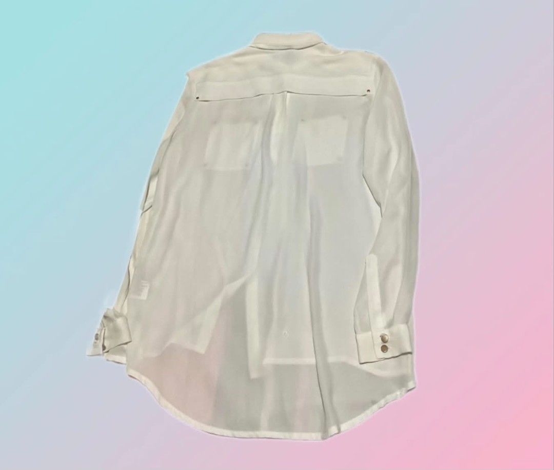 H&M White Button-Up Blouse with Pocket Details (Category: Blouses) located in Paranaque City. Submitted by calm_youngstore7 (Listing ID 1470989115, Image 2). Description: LAST PIECE SALE! - Brand: H&M - Condition: Brand new with original store tags attached - Color: Crisp white - Size: EUR 32, US 2, CA 2 - Material: Lightweight with a slight sheer look - Details: Classic collar, front button closure, button cuffs, and chest pockets with stylish s