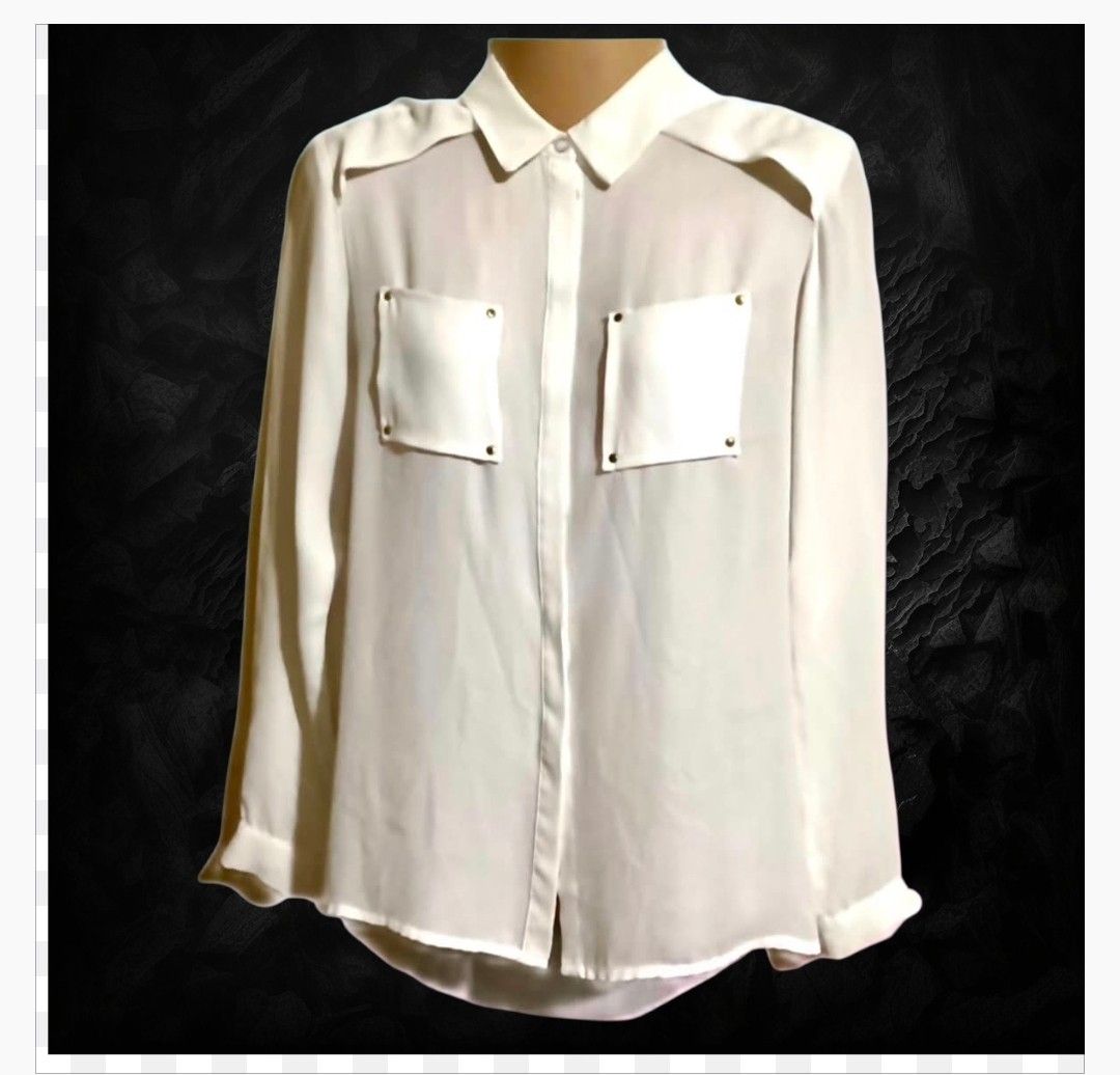 H&M White Button-Up Blouse with Pocket Details (Category: Blouses) located in Paranaque City. Submitted by calm_youngstore7 (Listing ID 1470989115, Image 1). Description: LAST PIECE SALE! - Brand: H&M - Condition: Brand new with original store tags attached - Color: Crisp white - Size: EUR 32, US 2, CA 2 - Material: Lightweight with a slight sheer look - Details: Classic collar, front button closure, button cuffs, and chest pockets with stylish s