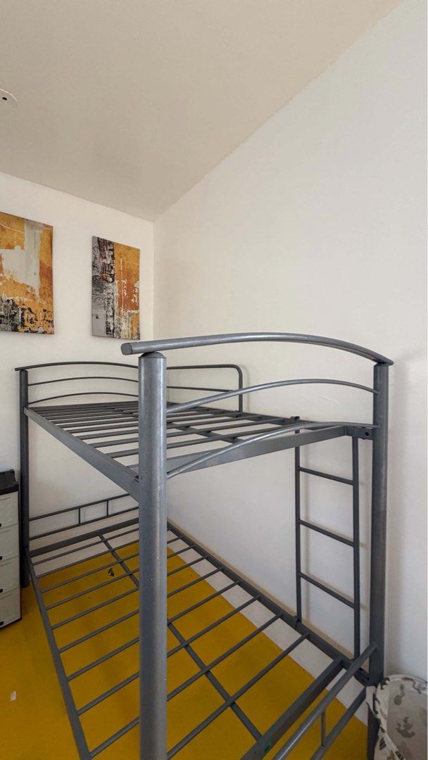 Home Suite Double Deck Single Bed Frame (Category: Bed Frames & Mattresses) located in Manila. Submitted by belaciao09 (Listing ID 1471058265, Image 2). Description: - Brand: Home Suite - Material/Design: Sturdy industrial metal frame in dark grey finish - Features: Built-in ladder and secure slatted base support - Inclusions: Comes with one blue patterned mattress - Condition/Notes: Excellent space saver for bedrooms or guest rooms - Logistics: 