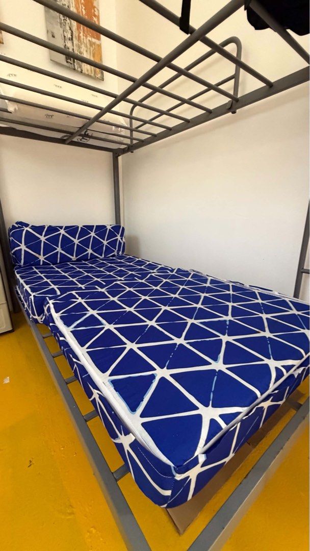 Home Suite Double Deck Single Bed Frame (Category: Bed Frames & Mattresses) located in Manila. Submitted by belaciao09 (Listing ID 1471058265, Image 3). Description: - Brand: Home Suite - Material/Design: Sturdy industrial metal frame in dark grey finish - Features: Built-in ladder and secure slatted base support - Inclusions: Comes with one blue patterned mattress - Condition/Notes: Excellent space saver for bedrooms or guest rooms - Logistics: 