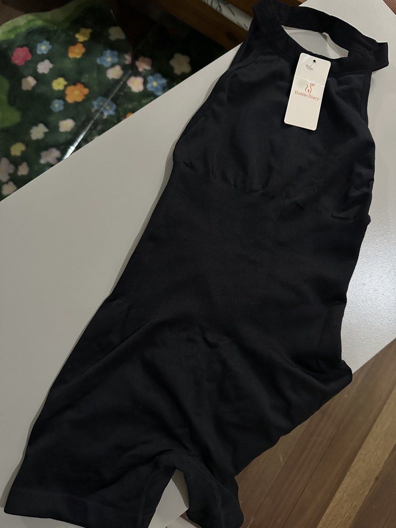 Hottie Diary Black Romper Size S (Category: Rompers) located in Antipolo. Submitted by wxyz9876 (Listing ID 1470962862, Image 1). Description: - Brand: Hottie Diary - Condition: Brand new with tag (BNWT) - Size: S - Color: Black - Material: 85% polyamide, 15% elastane - Design: Ribbed fabric, halter neckline, open back, and ruched back detail.