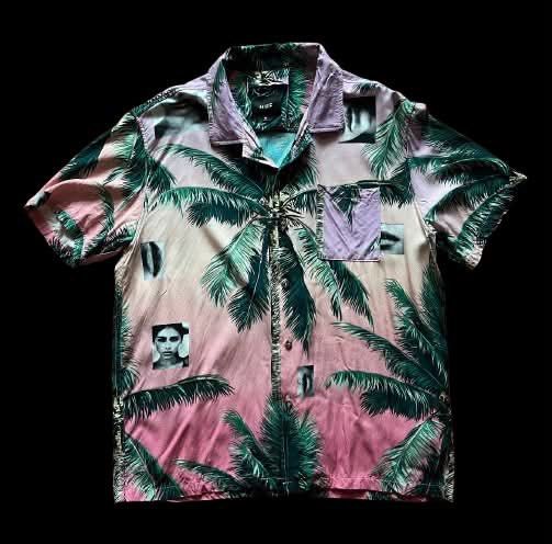 Huf Hawaiian Polo (Category: Tshirts & Polo Shirts ) located in Caloocan City. Submitted by landcruiser76__ (Listing ID 1471078030, Image 1). Description: - Brand: HUF - Style: Short sleeve button-up with Cuban collar and single chest pocket - Design: Unique pink and green palm tree graphic print mixed with edgy face photo details - Material: 100% rayon (super soft, lightweight, and breathable) - Size: Medium (tag on collar) - Extras: Extra butto