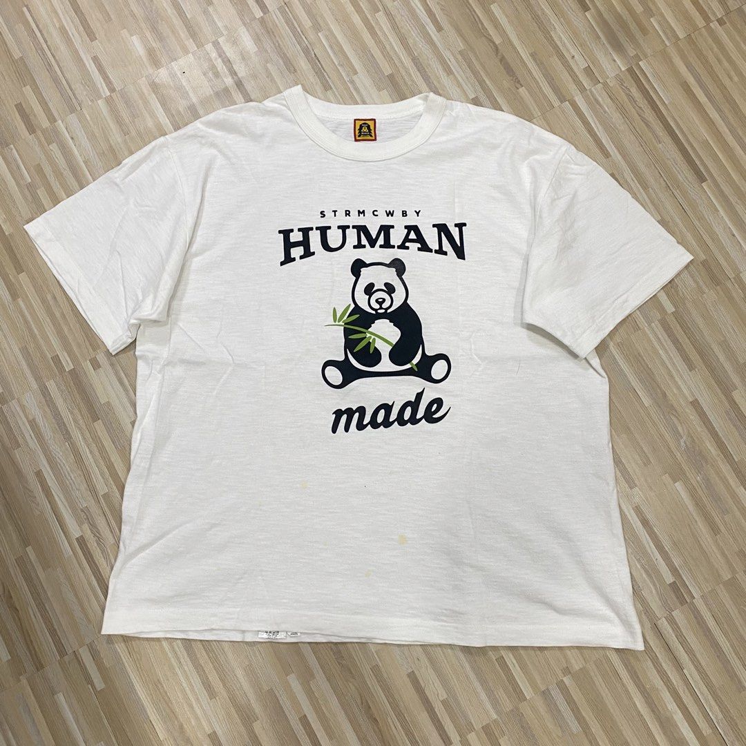 Human Made Panda White Graphic T-Shirt (Category: Shirts) located in Manila. Submitted by scapethrift (Listing ID 1470973911, Image 1). Description: - Brand: Human Made - Item: White graphic tee with panda eating bamboo and 'STRMCWBY HUMAN made' lettering - Size: Large - Material: 100% cotton, made in Japan - Condition: Comes with inner care tags and neck label; note a few faint yellow stains near the bottom front area.