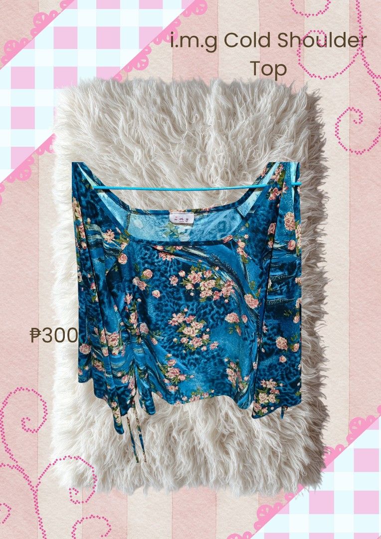 i.m.g Fairycore/Whimsycore Cold Shoulder Top (Category: Sleeveless) located in Manila. Submitted by lotuline (Listing ID 1470940922, Image 1). Description: - Brand: i.m.g -Size: Can fit S-M - Design: Cold shoulder with a unique mix of animal print and scattered pink roses - Fit: Adjustable side drawstrings to alter the hem length - Fabric: Lightweight and breathable, ideal for warm weather - Styling: Versatile piece that looks great with both jea