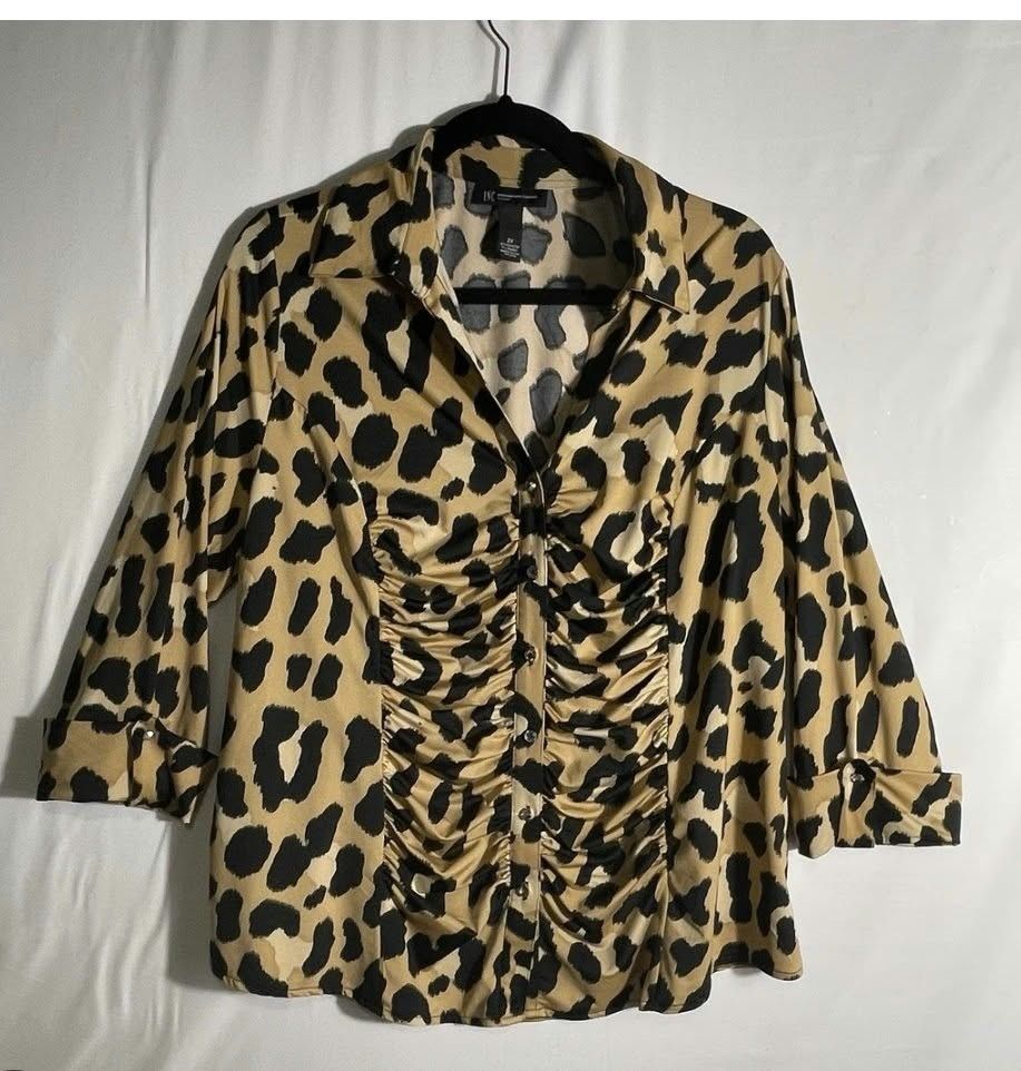 INC International Concepts Leopard Print Ruffled Button Blouse (Category: Blouses) located in Manila. Submitted by duffy-080 (Listing ID 1470988772, Image 1). Description: - Brand: INC International Concepts - Pattern: Bold tan and black leopard print - Design: Chic ruched front with decorative center buttons and a classic collared neckline - Sleeves: Three-quarter length with trendy folded cuffs - Fabric: Lightweight and comfortable - Versatilit
