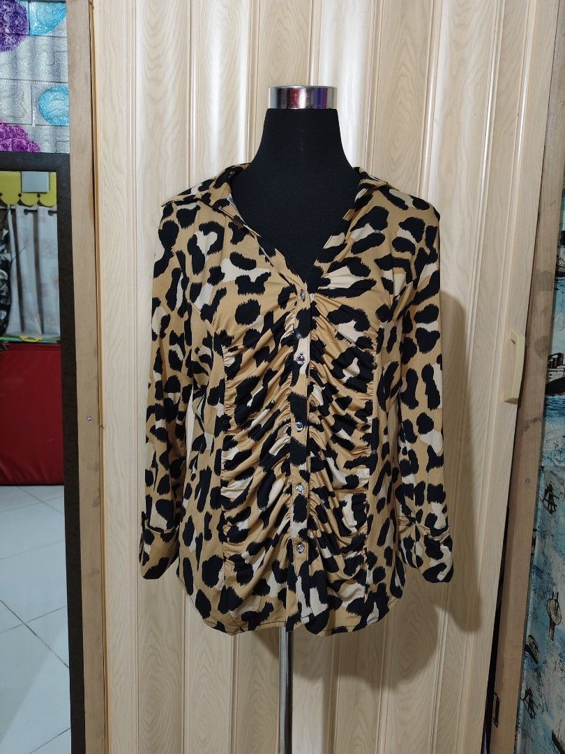 INC International Concepts Leopard Print Ruffled Button Blouse (Category: Blouses) located in Manila. Submitted by duffy-080 (Listing ID 1470988772, Image 3). Description: - Brand: INC International Concepts - Pattern: Bold tan and black leopard print - Design: Chic ruched front with decorative center buttons and a classic collared neckline - Sleeves: Three-quarter length with trendy folded cuffs - Fabric: Lightweight and comfortable - Versatilit