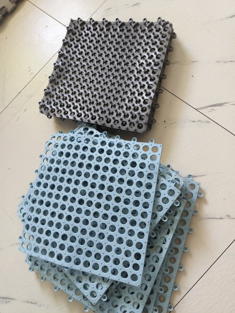 Interlocking drainage tiles plastic floor mats bundle grey blue (Category: Carpets, Mats & Flooring) located in Manila. Submitted by jewfindshop (Listing ID 1470989488, Image 1). Description: - Bundle includes grey and light blue interlocking plastic floor tiles - Features circular drainage holes and knob patterns on the reverse for secure grip - Easy snap-together installation for DIY setup - Ideal for balconies, bathrooms, laundry areas, and sh