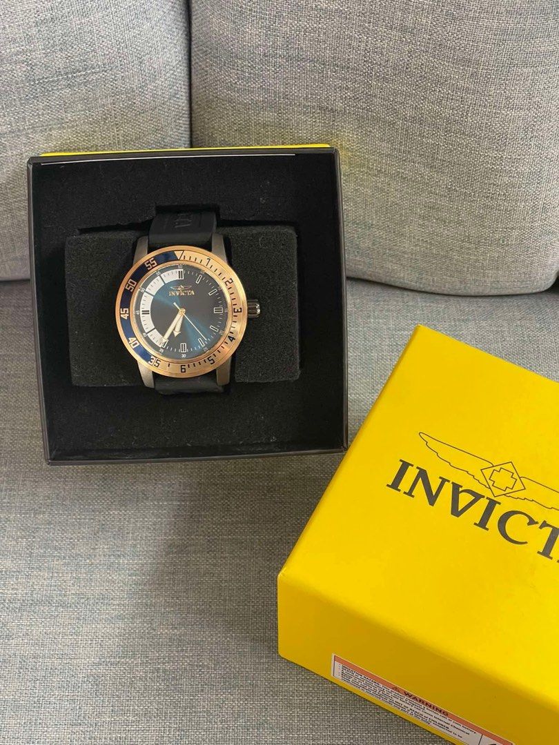 Invicta Watch with Yellow Box (Category: Women's Watches) located in Caloocan City. Submitted by Roowchelly (Listing ID 1470932982, Image 1). Description: - Brand: Invicta - Design: Bold sporty look with a blue dial, rose gold bezel, and durable black rubber strap - Condition: Clean, well-maintained, and ready for a new owner - Inclusions: Comes with the original bright yellow Invicta presentation box - Perfect as a stylish everyday timepiece.