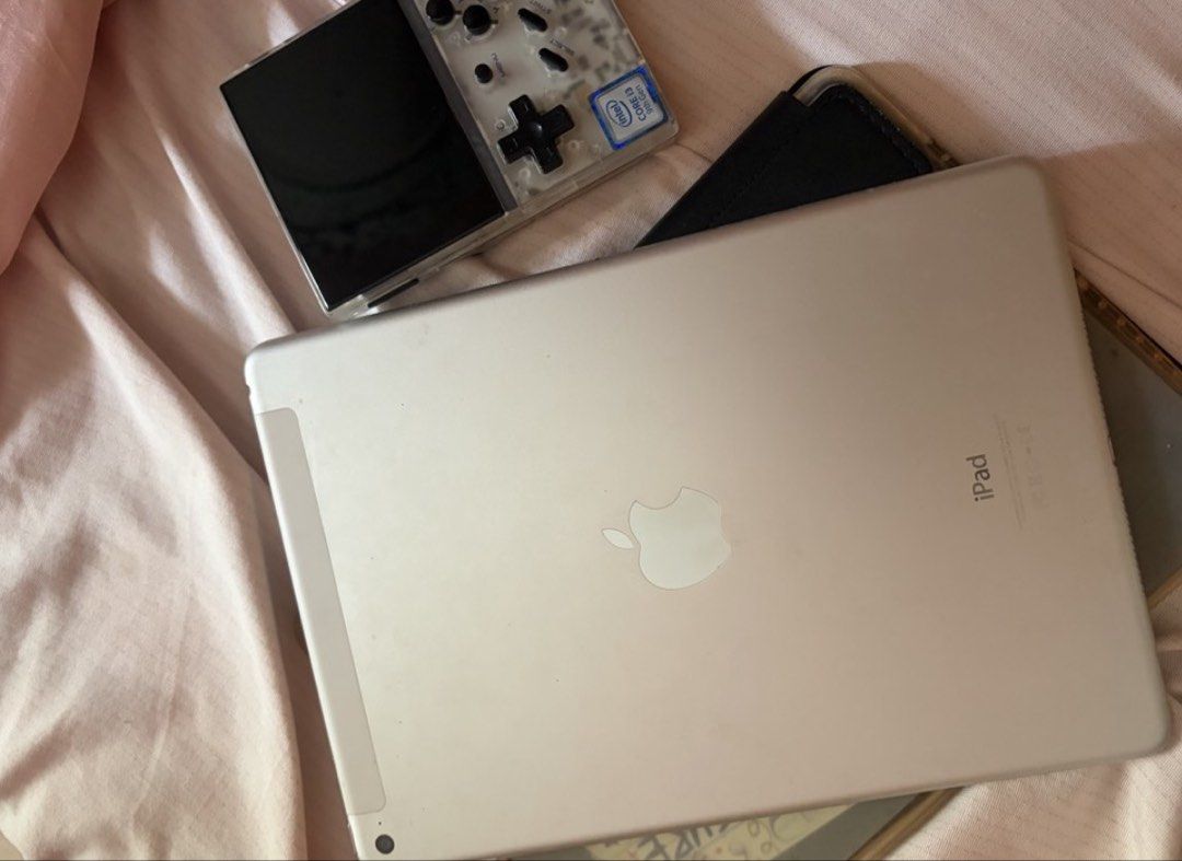 IPAD AIR 2 AND GAMEBOY BUNDLE (Category: iPad) located in Pasig City. Submitted by seleneaki (Listing ID 1470954513, Image 3). Description: - Silver iPad Air 2 - 128GB Storage - Wi-Fi + Cellular - Running iPadOS 15.8.4 - Comes with a black case - lady-owned. Still runs smoothly - Ideal for light browsing, games, and apps - Gameboy Anbernic RG35XX i3 9th gen with 128gb preloaded games.