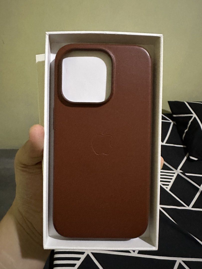 iPhone 14 Pro Apple Leather Case (Genuine) (Category: Cases & Sleeves) located in San Fernando. Submitted by jcpzz (Listing ID 1470978146, Image 2). Description: Umber color Guaranteed authentic Apple Leather Case magsafe compatible.