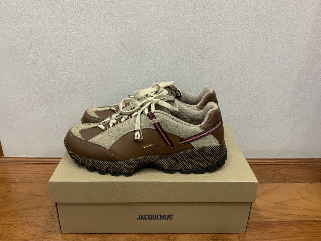 Jacquemus Nike Air Humara LX (Category: Sneakers) located in Mandaluyong City. Submitted by plaza.esquinita (Listing ID 1471090418, Image 3). Description: - Model: Jacquemus x Nike Air Humara LX - Colorway: Ale Brown and Gold with Pink accents - Materials: Premium leather and hairy suede overlays with a textured rubber sole - Size: Men's US 9 / Women's US 10.5 - Inclusions: Complete with original co-branded box - Condition: Brand new / pristine c