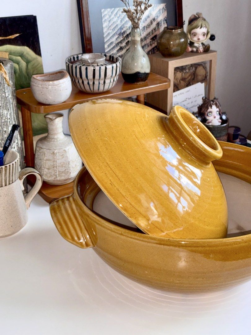Japanese Ceramic Donabe Clay Pot (Category: Cookware & Accessories) located in Manila. Submitted by jullialm (Listing ID 1471094292, Image 3). Description: Double sided handles hot pot, stews, and soups pot Condition: good/used, with signs of usage inside and under only. Not visible when in use.