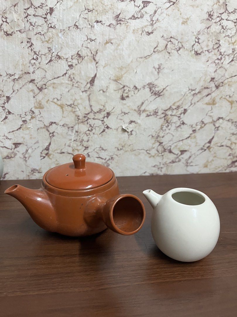 Japanese Kyusu Teapot with White Pitcher Set (Category: Vases & Decorative Bowls) located in Manila. Submitted by kayerrr.gem (Listing ID 1471047719, Image 2). Description: - Japanese kyusu teapot in a rich reddish-brown finish - Matching white globe-shaped tea pitcher included - Classic side-handle design for comfortable, easy pouring - Shows natural interior tea staining from regular, well-loved use - Ideal set for brewing loose leaf green tea,