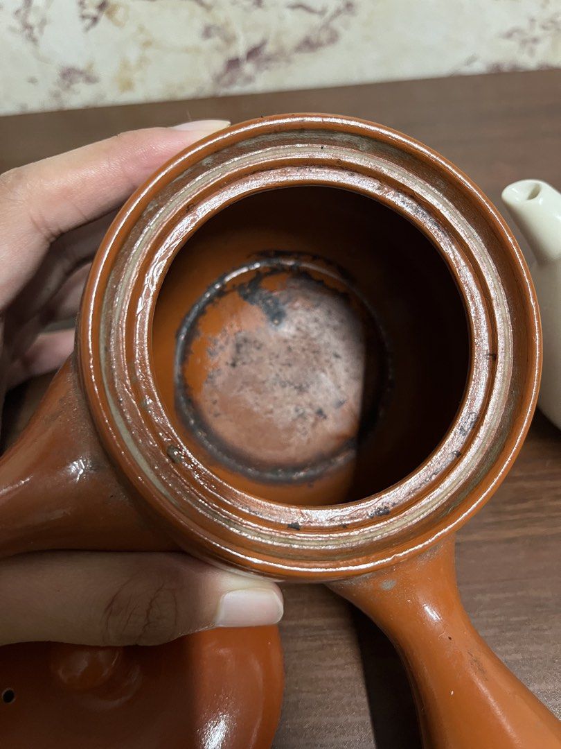 Japanese Kyusu Teapot with White Pitcher Set (Category: Vases & Decorative Bowls) located in Manila. Submitted by kayerrr.gem (Listing ID 1471047719, Image 3). Description: - Japanese kyusu teapot in a rich reddish-brown finish - Matching white globe-shaped tea pitcher included - Classic side-handle design for comfortable, easy pouring - Shows natural interior tea staining from regular, well-loved use - Ideal set for brewing loose leaf green tea,