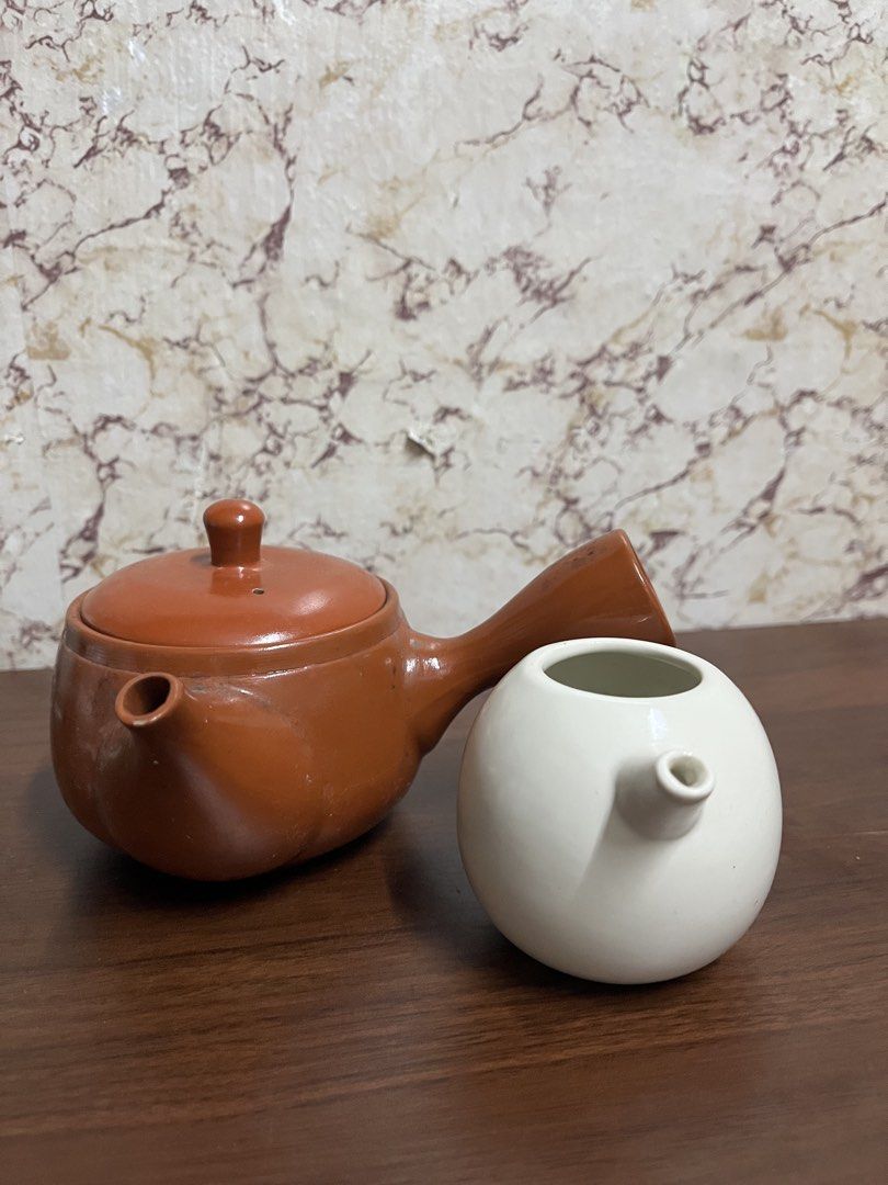 Japanese Kyusu Teapot with White Pitcher Set (Category: Vases & Decorative Bowls) located in Manila. Submitted by kayerrr.gem (Listing ID 1471047719, Image 1). Description: - Japanese kyusu teapot in a rich reddish-brown finish - Matching white globe-shaped tea pitcher included - Classic side-handle design for comfortable, easy pouring - Shows natural interior tea staining from regular, well-loved use - Ideal set for brewing loose leaf green tea,
