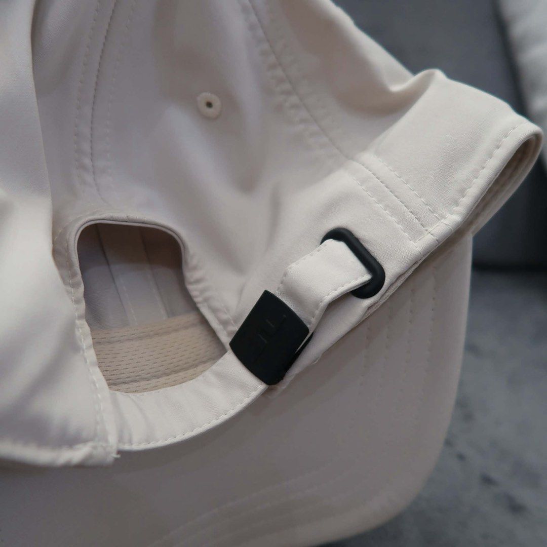 j.lindeberg Angus Golf Cap White One Size (Category: Caps & Hats) located in Manila. Submitted by mairalyng21434 (Listing ID 1471021833, Image 3). Description: - Authentic J.Lindeberg Angus Cap in crisp white - Features iconic embroidered bridge logo on the front - Made from 97% lightweight and breathable polyester - Interior sweatband lining for maximum comfort during rounds - Adjustable metal buckle closure at the back with debossed branding - 