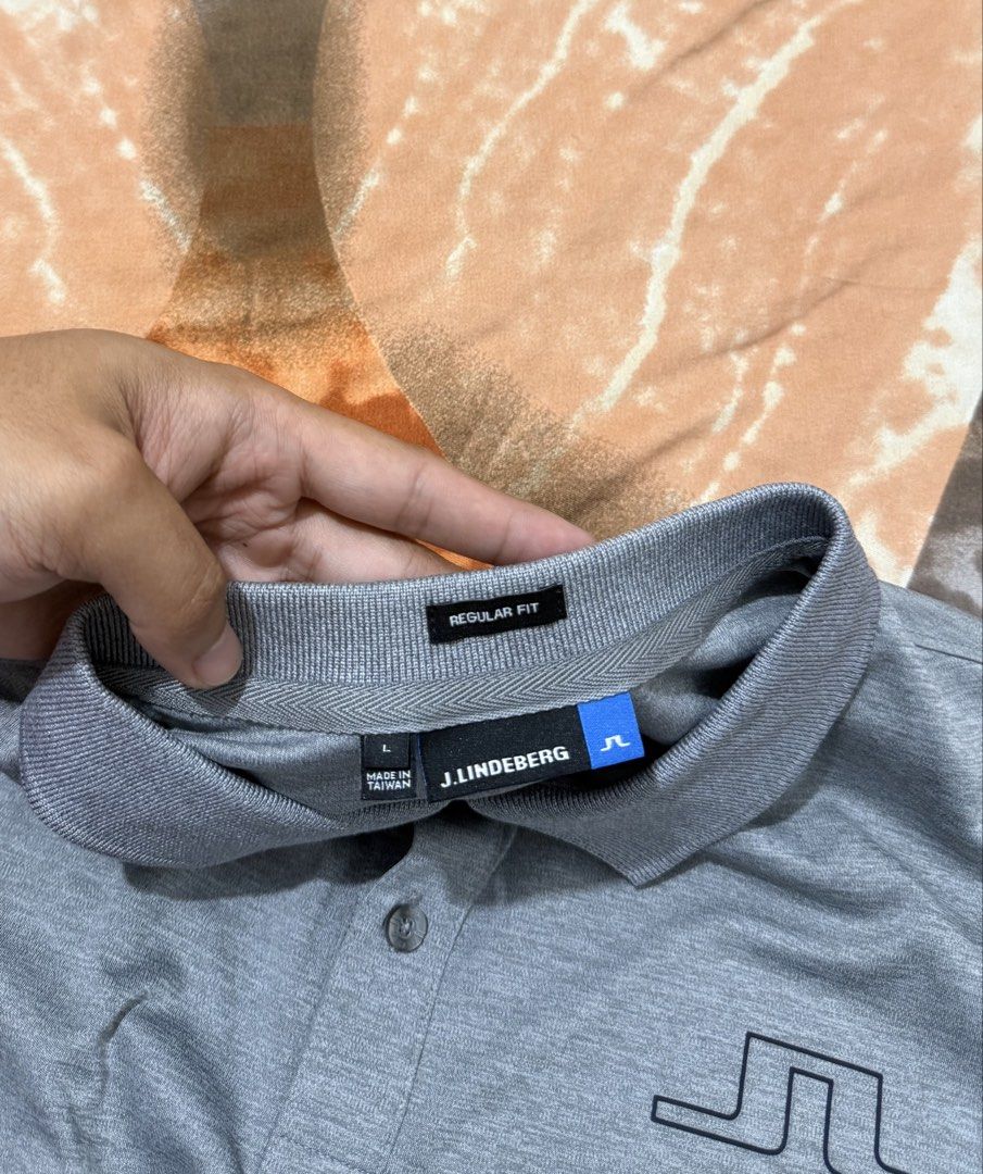 j.lindeberg Regular Fit Grey Polo Shirt (Category: Tshirts & Polo Shirts ) located in Manila. Submitted by calvinomateo14 (Listing ID 1471002033, Image 3). Description: - Brand: J.Lindeberg - Style: Regular fit polo shirt - Color: Grey - Size: L (Made in Taiwan) - Material: 100% polyester jersey - Features: Short sleeves, classic button placket, embroidered bridge logo on chest and back collar - Condition: Clean and ready to wear.