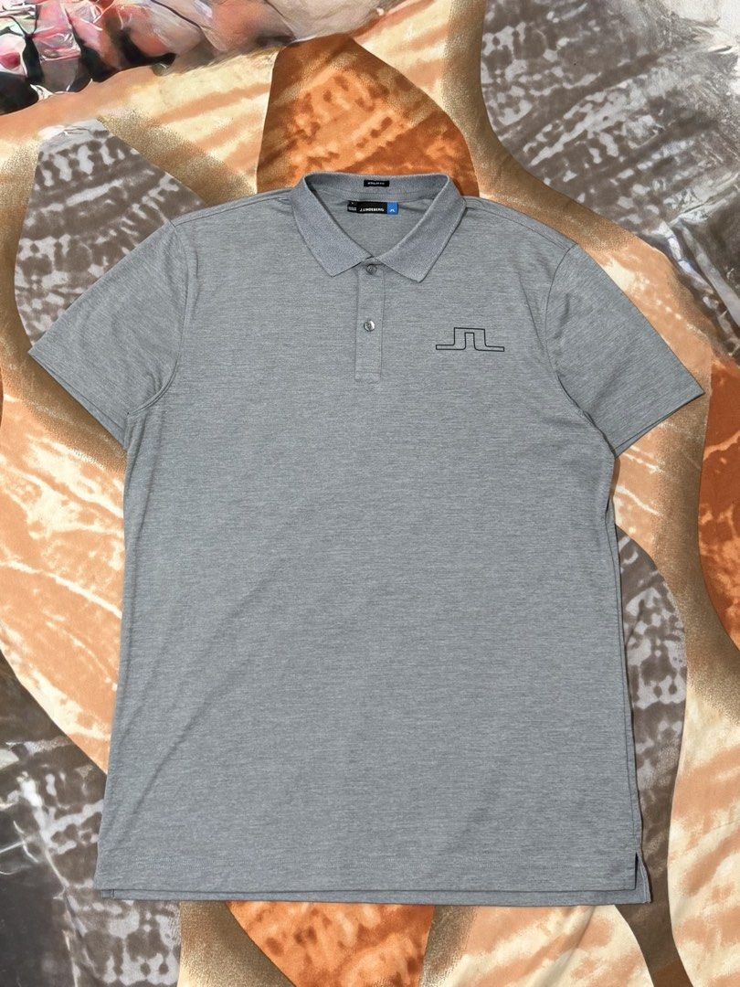 j.lindeberg Regular Fit Grey Polo Shirt (Category: Tshirts & Polo Shirts ) located in Manila. Submitted by calvinomateo14 (Listing ID 1471002033, Image 1). Description: - Brand: J.Lindeberg - Style: Regular fit polo shirt - Color: Grey - Size: L (Made in Taiwan) - Material: 100% polyester jersey - Features: Short sleeves, classic button placket, embroidered bridge logo on chest and back collar - Condition: Clean and ready to wear.