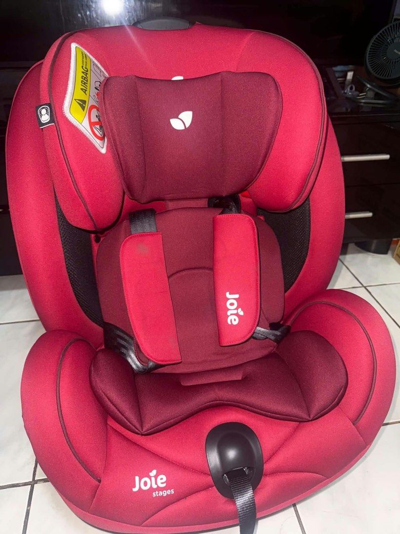 Joie Every Stage Car Seat Cranberry (Category: Car Seats) located in Manila. Submitted by scarletsabina (Listing ID 1471012639, Image 2). Description: - Model: Joie Every Stage Car Seat - Color: Cranberry Red with solid black plastic base - Age Range: Group 0+/1/2/3 (Newborn up to 12 years / 36 kg) - Installation: Uses vehicle seatbelt across all modes - Features: Adjustable headrest and harness system, handy side storage pockets - Condition: Cle