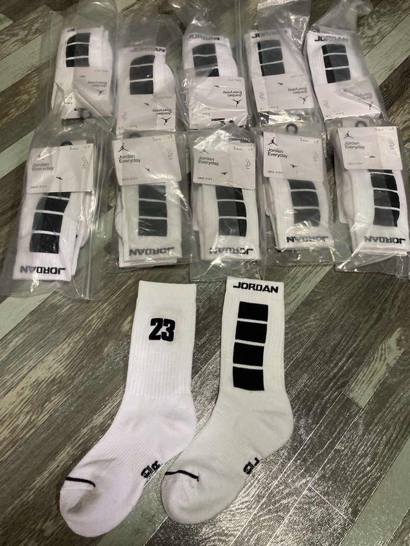 Jordan Everyday Crew Socks White Black 10 Pairs (Category: Socks) located in Pasig City. Submitted by alaincainglet (Listing ID 1470944521, Image 2). Description: - Item: Jordan Everyday Crew Socks (NEGO IF TAKE ALL) - Condition: Brand new, never worn, with original tags - Packaging: Individually sealed in clear plastic sleeves - Color/Design: White with black block stripes and '23' on the front ankle - Material: Dri-FIT moisture-wicking fabric -