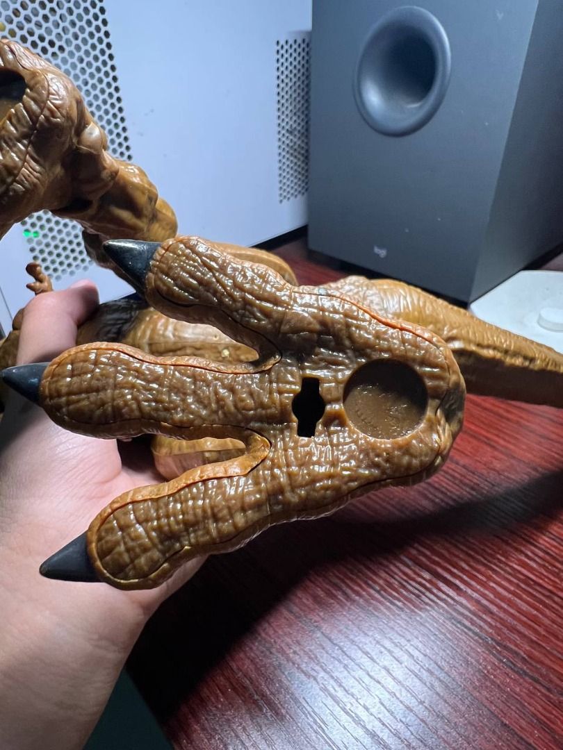 Jurassic World Dinosaur T-Rex (Category: Action & Battle Toys) located in Baguio. Submitted by ditoyzb08176 (Listing ID 1471069173, Image 3). Description: - Brown dinosaur action figure foot with realistic textured skin - Features detailed black painted claws - Built-in scan code on the bottom for interactive app integration - Durable plastic construction made to withstand playtime - Perfect addition to any dino collection Location: Baguio City S