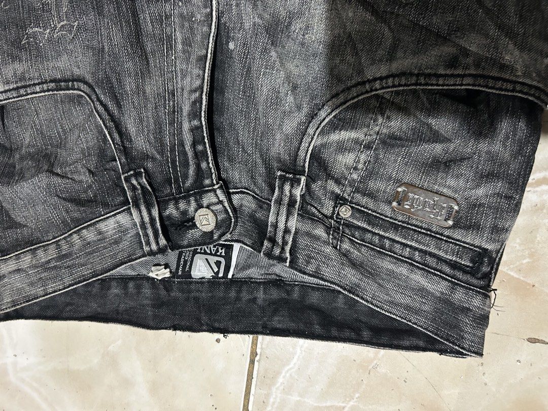 Karl Kani Black Denim Jeans Size 32 (Category: Jeans) located in Manila. Submitted by johnlinhar98425 (Listing ID 1471077681, Image 3). Description: - Brand: Karl Kani - Item: Black denim jeans with acid wash finish - Size: 32 - Fit: Straight leg - Details: Distinctive angled back pockets, branded leather patch on the waistband, metal button closure, and custom pocket lining - Style: Classic streetwear staple - Condition: Good.