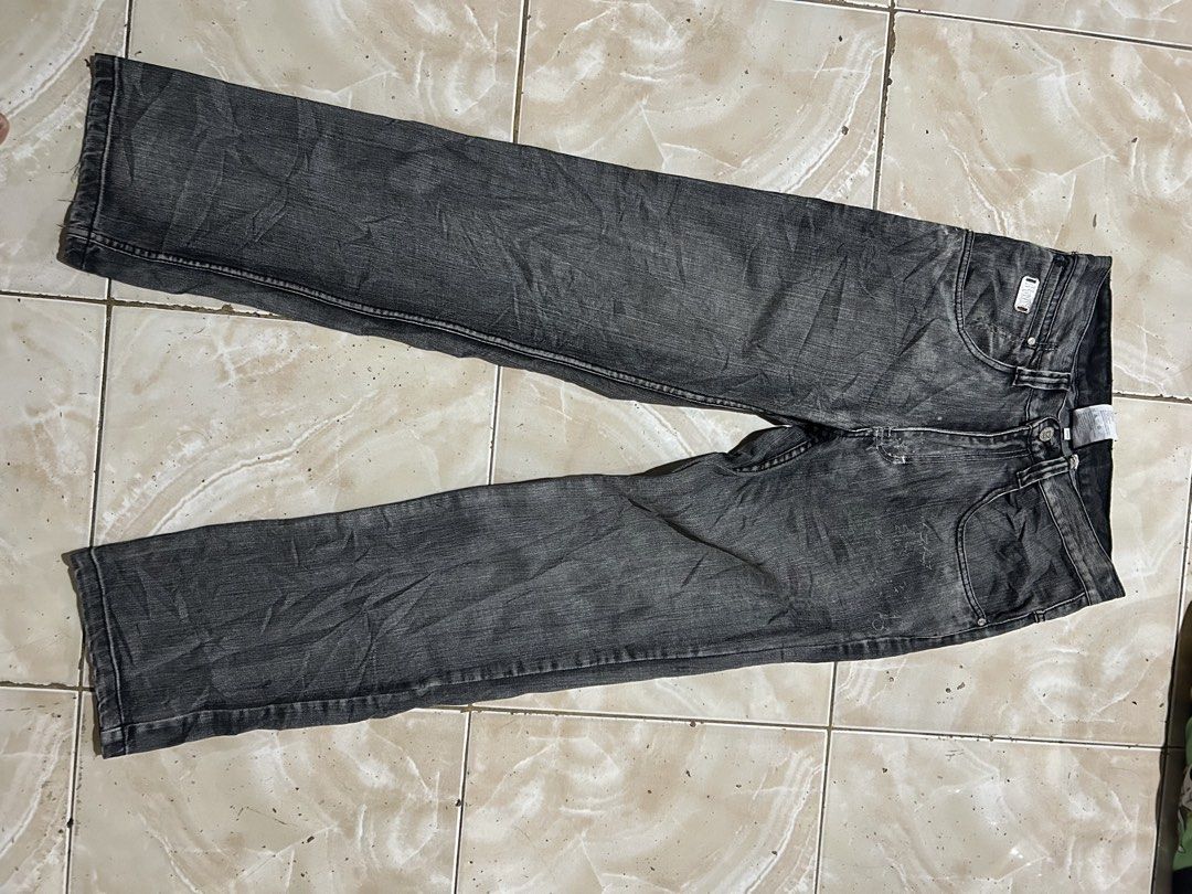 Karl Kani Black Denim Jeans Size 32 (Category: Jeans) located in Manila. Submitted by johnlinhar98425 (Listing ID 1471077681, Image 2). Description: - Brand: Karl Kani - Item: Black denim jeans with acid wash finish - Size: 32 - Fit: Straight leg - Details: Distinctive angled back pockets, branded leather patch on the waistband, metal button closure, and custom pocket lining - Style: Classic streetwear staple - Condition: Good.