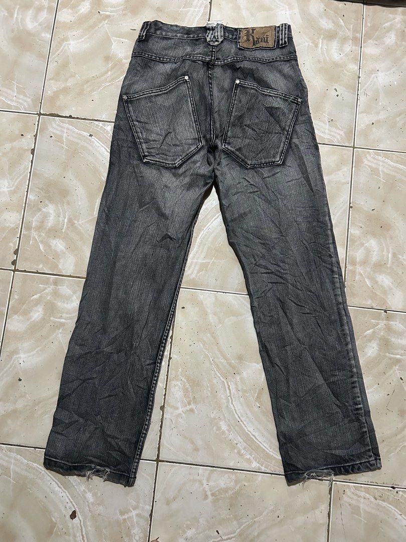 Karl Kani Black Denim Jeans Size 32 (Category: Jeans) located in Manila. Submitted by johnlinhar98425 (Listing ID 1471077681, Image 1). Description: - Brand: Karl Kani - Item: Black denim jeans with acid wash finish - Size: 32 - Fit: Straight leg - Details: Distinctive angled back pockets, branded leather patch on the waistband, metal button closure, and custom pocket lining - Style: Classic streetwear staple - Condition: Good.