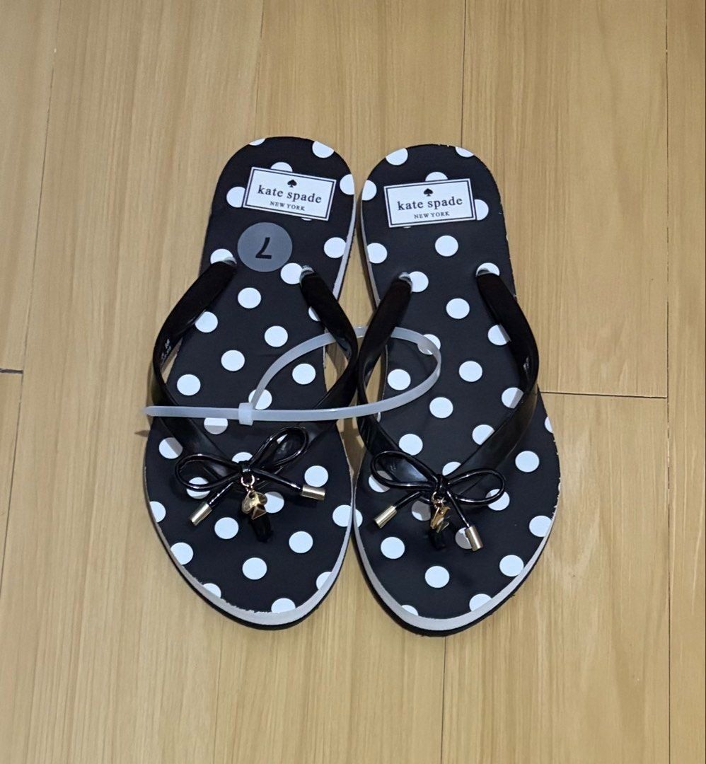 Kate Spade Polka dot Flip Flop Size 7 (Category: Slippers and slides) located in Quezon City. Submitted by beckyshop2024 (Listing ID 1471084668, Image 3). Description: - Brand new - Original from US - Color: Black and White - Features black bow and spade charm with gold-tone hardware - With few dents due to shipping from US via sea cargo.