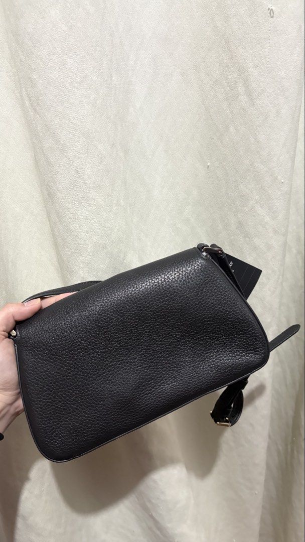 Kate Spade Sutton Mini Cbody Pebbled Leather Black (Category: Cross-body Bags) located in Manila. Submitted by ky.preloved1515 (Listing ID 1470947725, Image 2). Description: - Brand: Kate Spade - Model: Sutton Mini Crossbody - Material: Premium black pebbled leather - Hardware: Gold-tone hardware with front flap lettering - Interior: Fabric lining with convenient slip pockets - Condition: Brand new with original store tags (USD 299 price tag atta