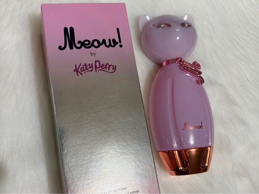 Katy Perry Meow Eau De Parfum 100ml (Category: Fragrance & Deodorants) located in Tiaong. Submitted by beautybyrosie (Listing ID 1471067178, Image 2). Description: - Brand: Katy Perry Meow Eau de Parfum original bought in USA - Size: 100 ml bottle - Condition: Brand new, unopened with original box - Bottle Design: Iconic pink cat-shaped bottle with rose gold collar and 'M' charm - Fragrance Notes: Sweet vanilla and fruity - Origin: Manufactured b