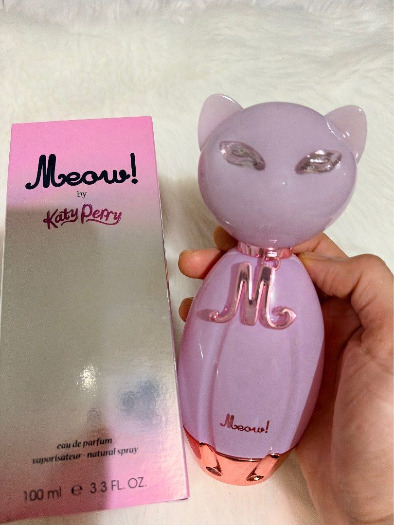 Katy Perry Meow Eau De Parfum 100ml (Category: Fragrance & Deodorants) located in Tiaong. Submitted by beautybyrosie (Listing ID 1471067178, Image 1). Description: - Brand: Katy Perry Meow Eau de Parfum original bought in USA - Size: 100 ml bottle - Condition: Brand new, unopened with original box - Bottle Design: Iconic pink cat-shaped bottle with rose gold collar and 'M' charm - Fragrance Notes: Sweet vanilla and fruity - Origin: Manufactured b