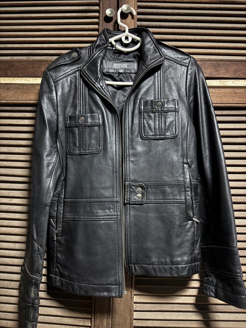 Kenneth Cole Reaction Black Leather Jacket Size M (Category: Coats, Jackets and Outerwear) located in Angono. Submitted by gie_vicente (Listing ID 1470987507, Image 1). Description: - Brand: Kenneth Cole Reaction - Color: Black - Material: Leather - Size: Medium (M) - Closure: Full zip front - Pockets: Multiple front flap pockets - Details: Waist strap with snap buttons, classic biker-style silhouette - Origin: Made in China - Condition: Solid co